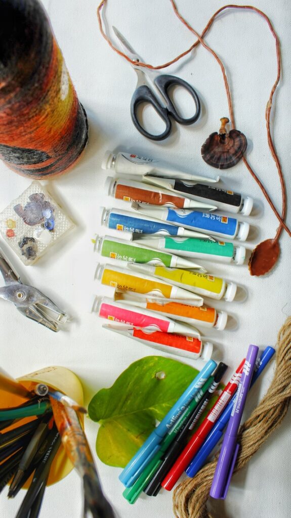 Display of crafting materials, yarn, markers, scissors.